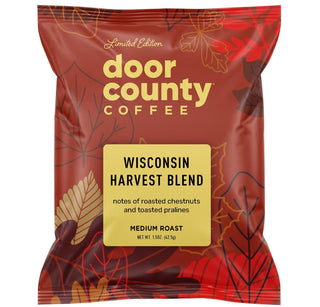 A bag of Door County Coffee Wisconsin Harvest Blend medium roast coffee, shown on a white background with promotional text above and below.