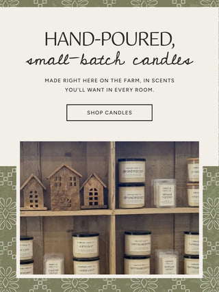 Hand-poured, small-batch candles on the shelves at The Farmhouse