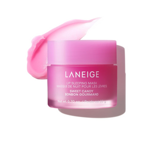 LANEIGE Lip Sleeping Mask in Sweet Candy pink, shown in a translucent jar with a matching lid and a decorative pink smear behind it on a white background.